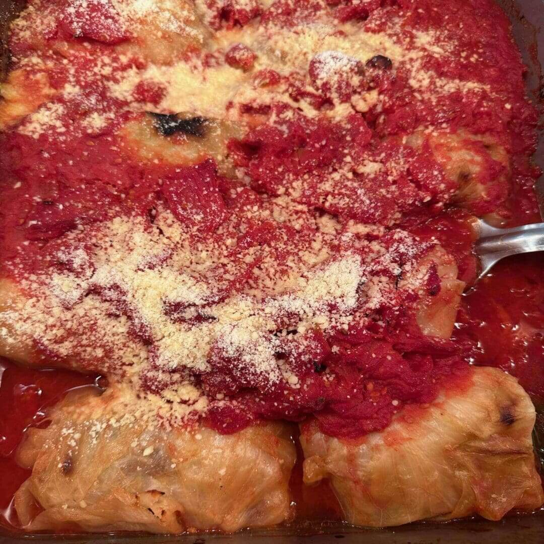 A close up of some food with sauce and cheese